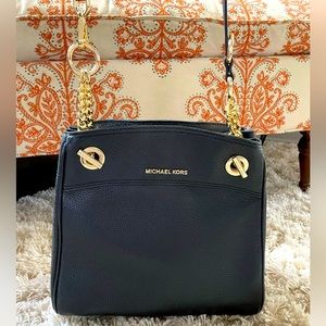 Black leather shoulder/crossbody tote with gold chain and hardware.